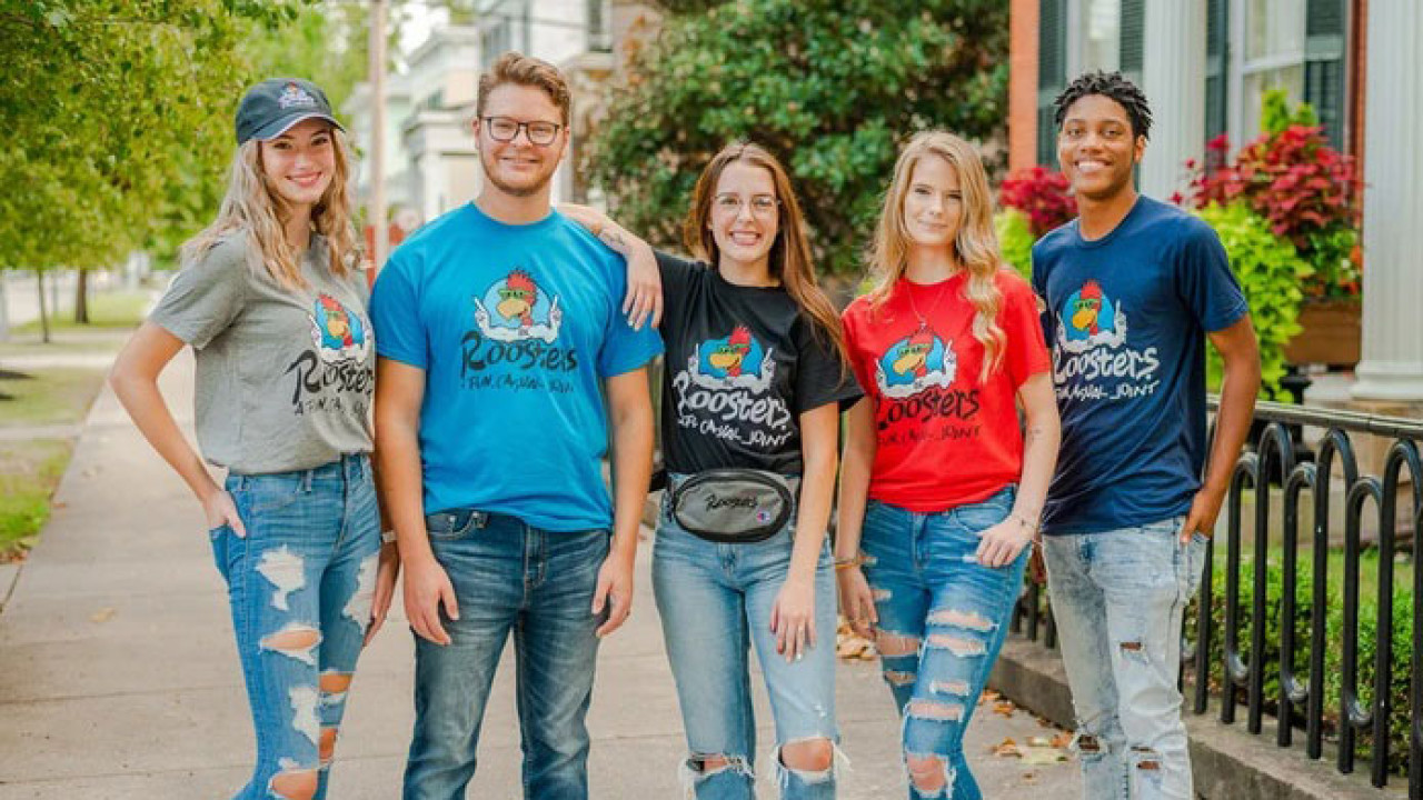 Roosters Employees in different color shirts